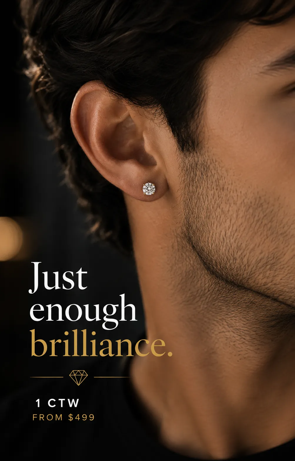 Round diamond stud earring worn by a man