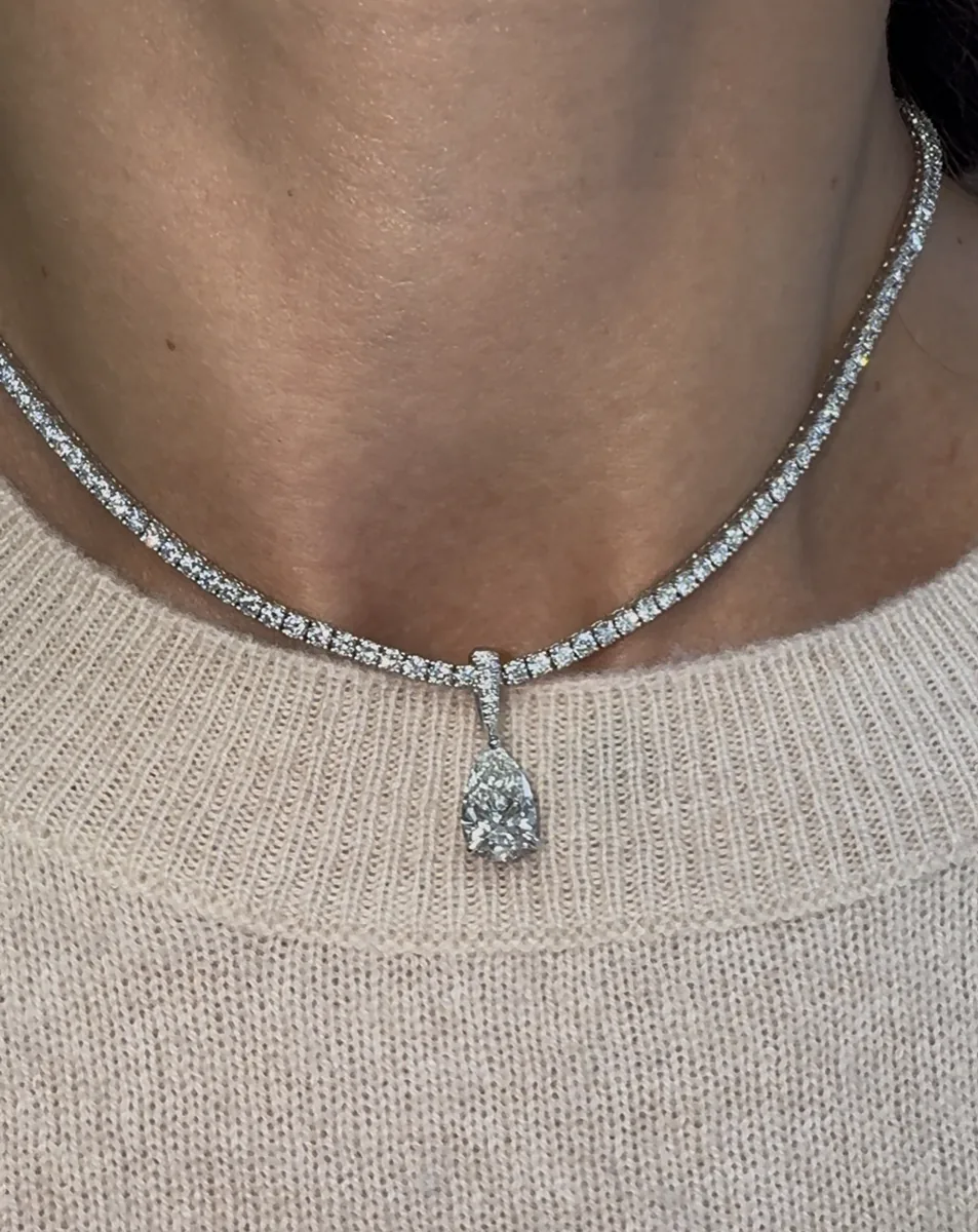 Pear-shaped diamond pendant on a tennis necklace